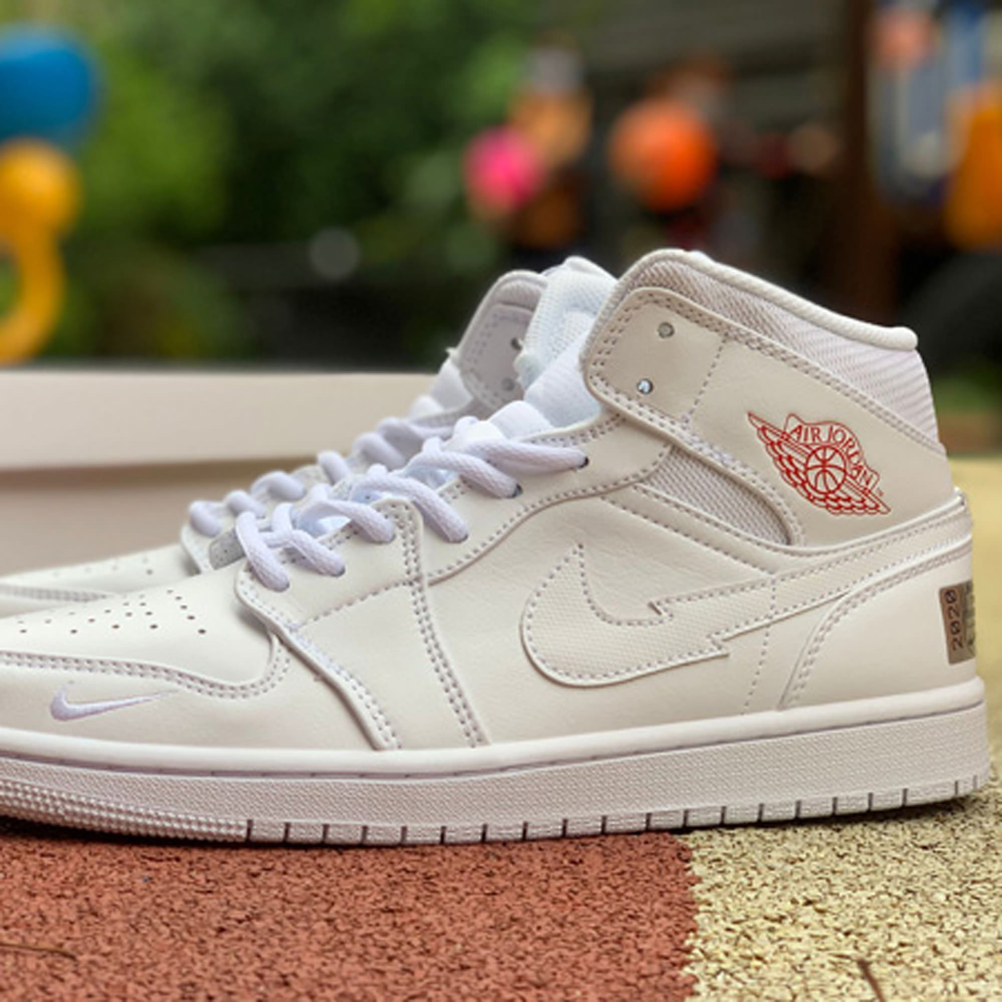 jordan 1 mid nike swoosh on tour